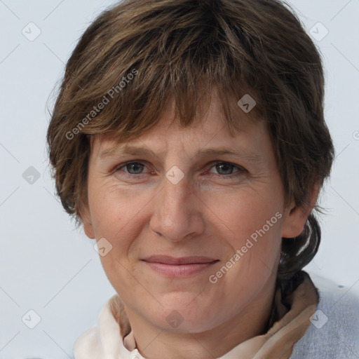 Joyful white adult female with medium  brown hair and grey eyes