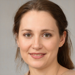 Joyful white young-adult female with medium  brown hair and brown eyes