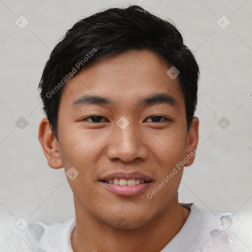 Joyful asian young-adult male with short  black hair and brown eyes