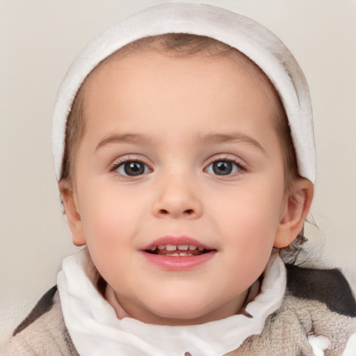 Joyful white child female with short  brown hair and brown eyes