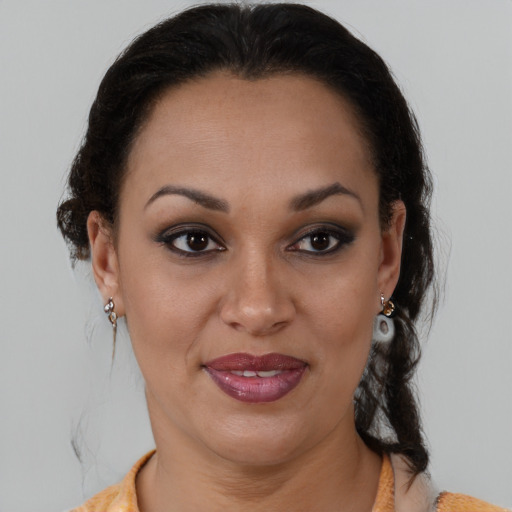 Joyful latino young-adult female with medium  brown hair and brown eyes