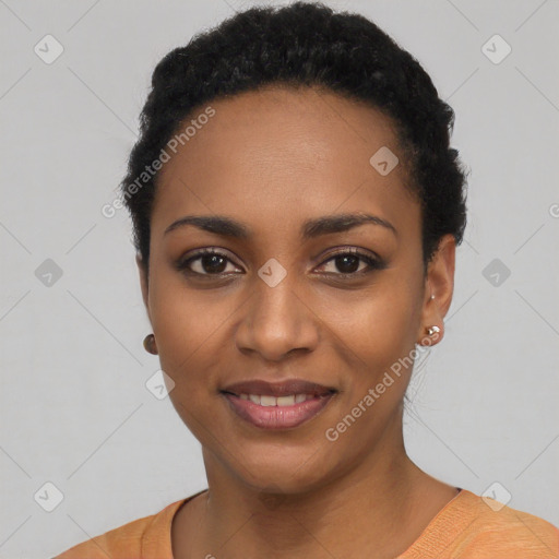 Joyful black young-adult female with short  black hair and brown eyes