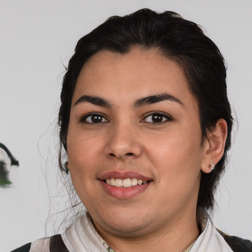 Joyful white young-adult female with medium  black hair and brown eyes