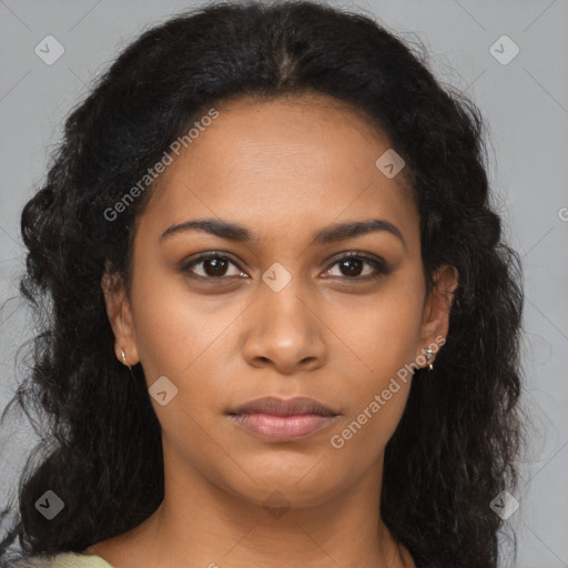 Joyful black young-adult female with long  brown hair and brown eyes