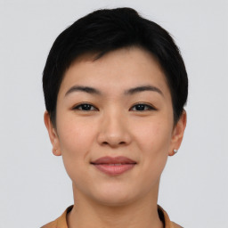 Joyful asian young-adult female with short  black hair and brown eyes