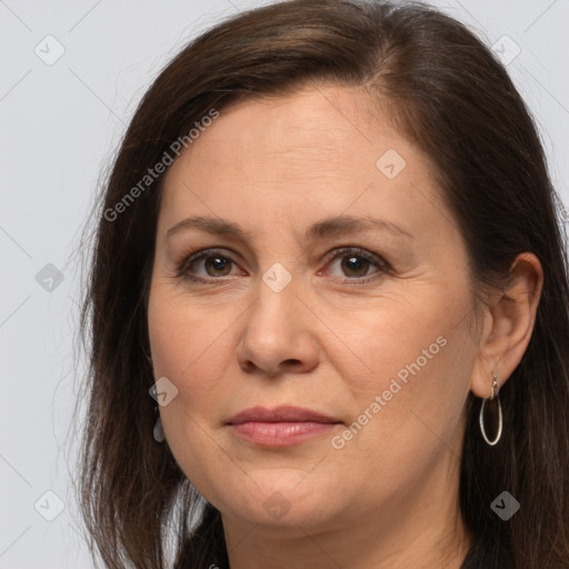 Joyful white adult female with long  brown hair and brown eyes