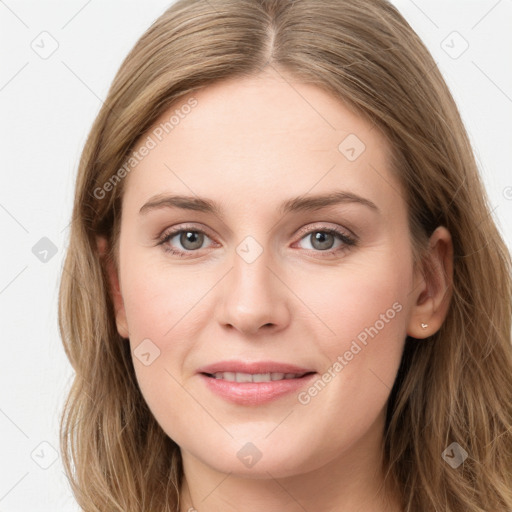 Joyful white young-adult female with long  brown hair and blue eyes