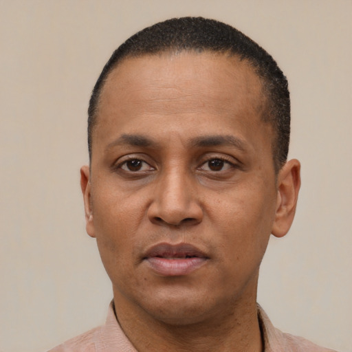 Neutral latino adult male with short  black hair and brown eyes