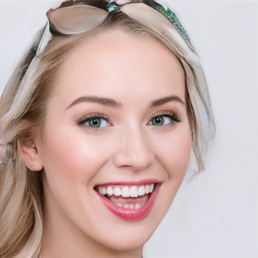 Joyful white young-adult female with long  brown hair and blue eyes