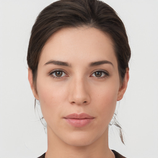 Neutral white young-adult female with medium  brown hair and brown eyes