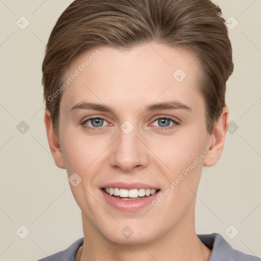 Joyful white young-adult female with short  brown hair and grey eyes