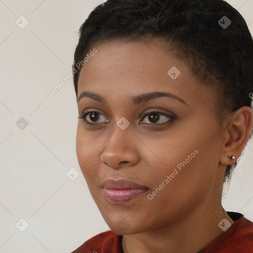 Joyful black young-adult female with short  brown hair and brown eyes