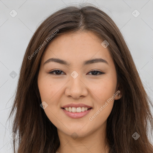 Joyful latino young-adult female with long  brown hair and brown eyes