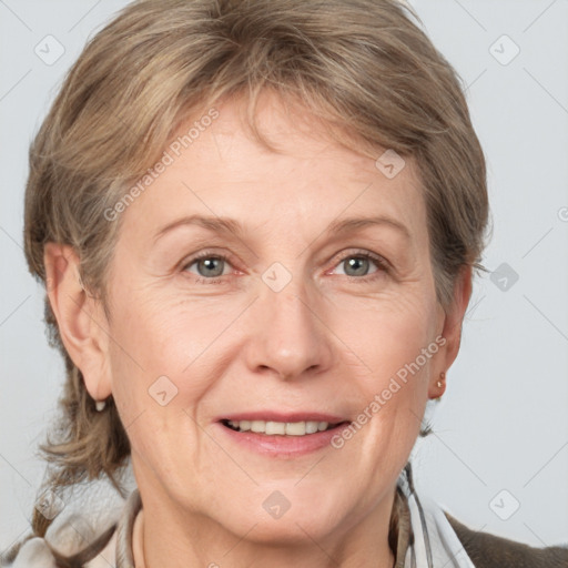 Joyful white adult female with medium  brown hair and grey eyes