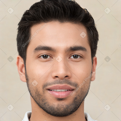 Joyful white young-adult male with short  black hair and brown eyes