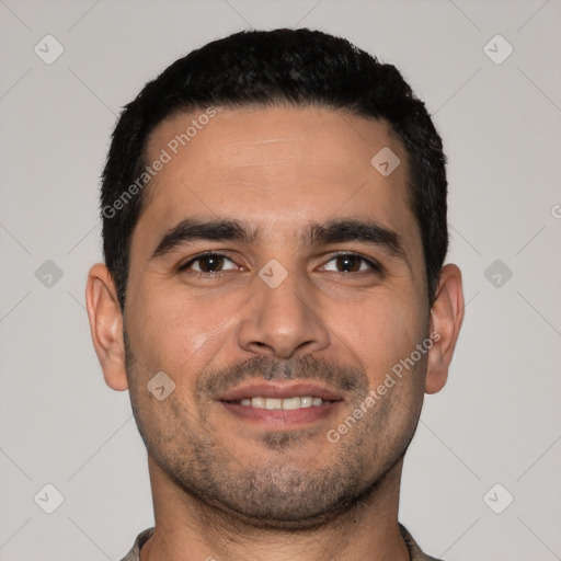 Joyful white young-adult male with short  black hair and brown eyes