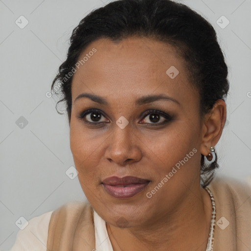 Joyful black young-adult female with short  brown hair and brown eyes