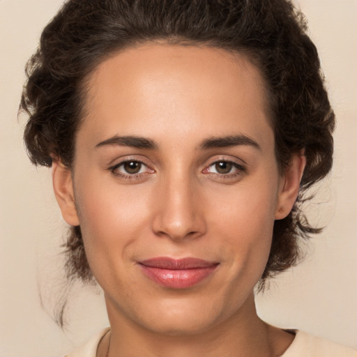 Joyful white young-adult female with medium  brown hair and brown eyes