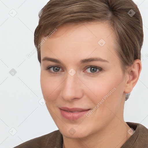 Joyful white young-adult female with short  brown hair and brown eyes