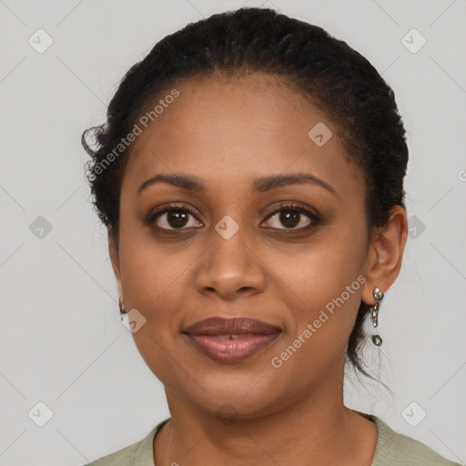 Joyful black young-adult female with short  brown hair and brown eyes