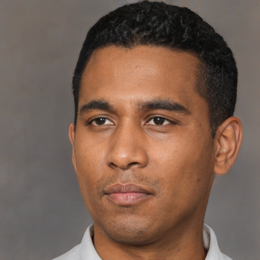 Neutral latino young-adult male with short  black hair and brown eyes