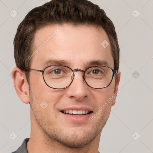 Joyful white adult male with short  brown hair and grey eyes