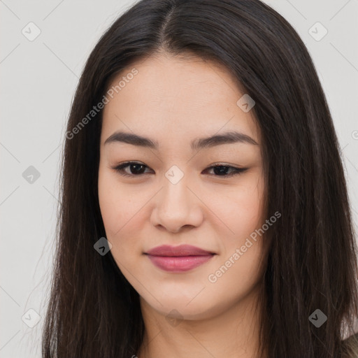 Joyful asian young-adult female with long  brown hair and brown eyes