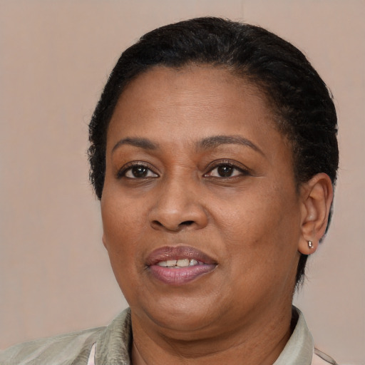 Joyful latino adult female with short  brown hair and brown eyes