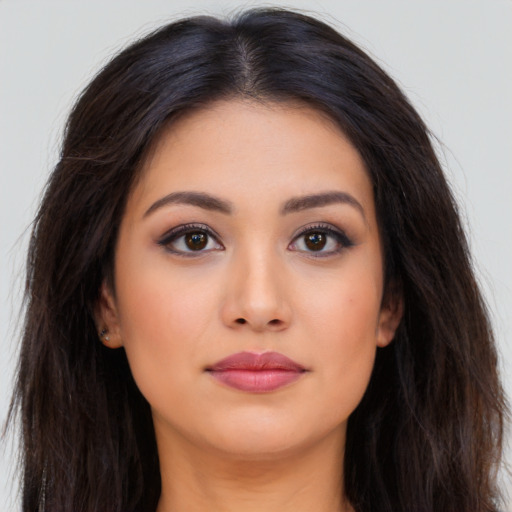 Neutral latino young-adult female with long  brown hair and brown eyes