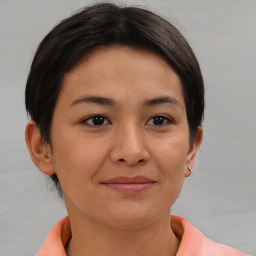 Joyful asian young-adult female with short  brown hair and brown eyes