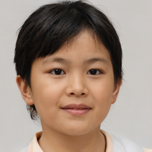 Joyful asian child female with short  brown hair and brown eyes