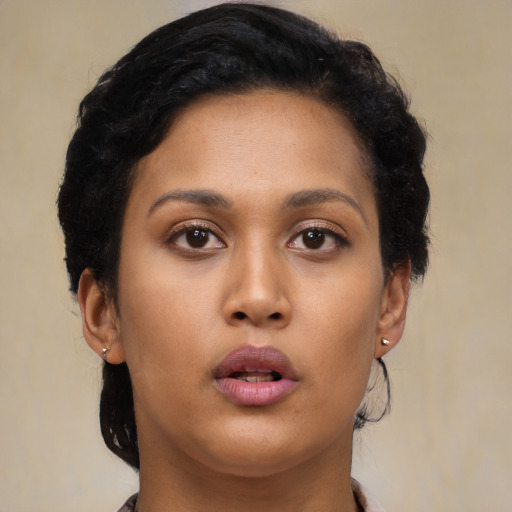 Neutral black young-adult female with long  brown hair and brown eyes