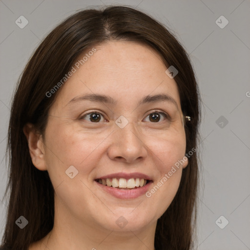 Joyful white adult female with medium  brown hair and brown eyes