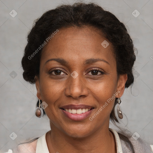 Joyful black adult female with short  brown hair and brown eyes