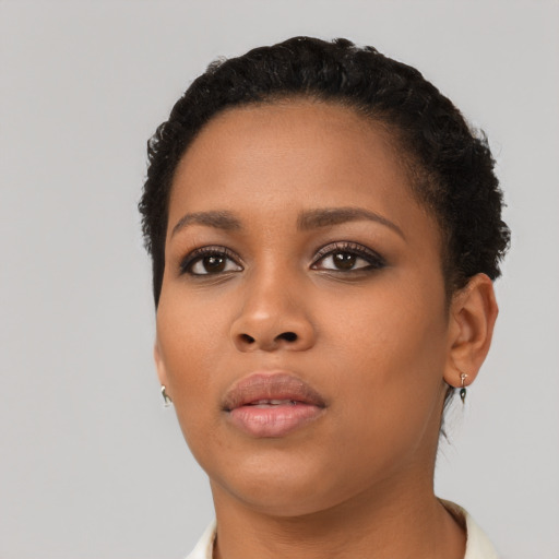 Neutral latino young-adult female with short  black hair and brown eyes