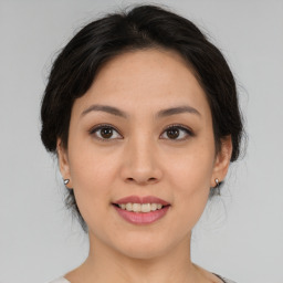 Joyful asian young-adult female with medium  brown hair and brown eyes