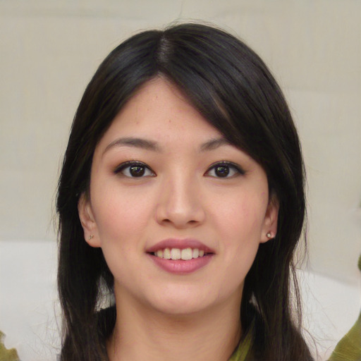 Joyful asian young-adult female with medium  black hair and brown eyes