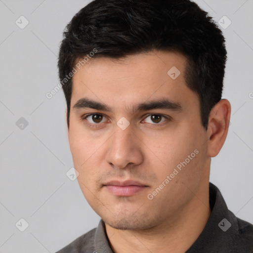 Neutral white young-adult male with short  black hair and brown eyes