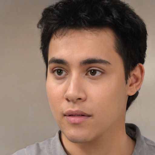 Neutral white young-adult male with short  black hair and brown eyes