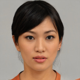 Neutral asian young-adult female with medium  black hair and brown eyes