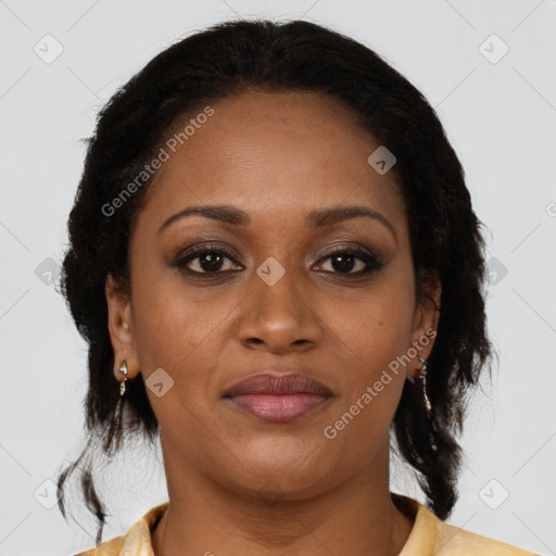 Joyful black adult female with medium  brown hair and brown eyes