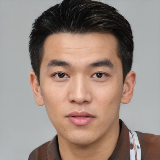 Neutral white young-adult male with short  black hair and brown eyes