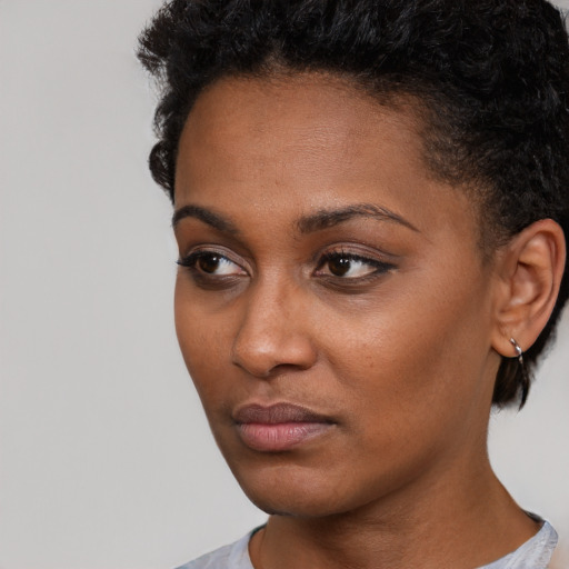 Neutral black young-adult female with short  black hair and brown eyes