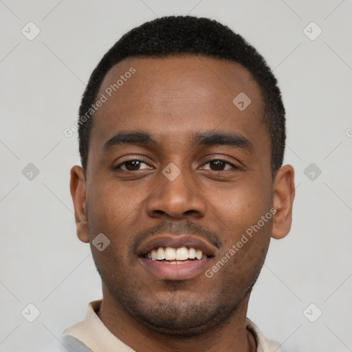 Joyful black young-adult male with short  black hair and brown eyes