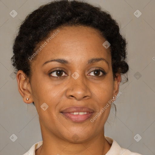 Joyful black adult female with short  brown hair and brown eyes