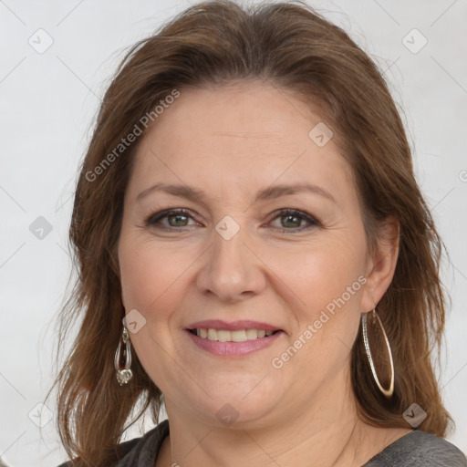 Joyful white adult female with medium  brown hair and brown eyes