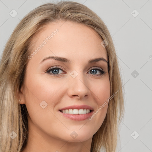 Joyful white young-adult female with long  brown hair and blue eyes