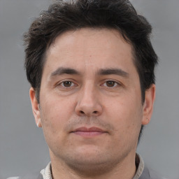 Neutral white adult male with short  brown hair and brown eyes