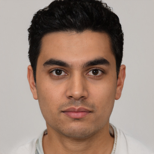 Neutral latino young-adult male with short  black hair and brown eyes