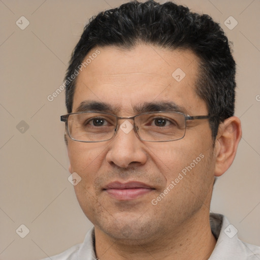 Joyful white adult male with short  black hair and brown eyes